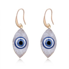 Retro personality eyes imitation natural stone resin earrings