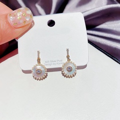 diamond-studded natural shell circle earrings