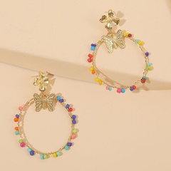 Europäische und amerikanische Farbe hand gewebte Reis perlen Schmetterlings ohrringe grenz überschreitende personal isierte geometrische Harz perlen Ohrringe Schmuck