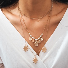 nouveau alliage bijoux rétro style ethnique ronde pièce de monnaie soleil multicouche collier de perles de riz en gros nihaojewelry