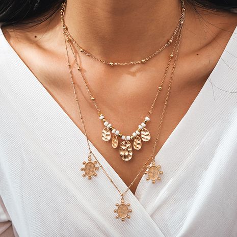 nouveau alliage bijoux rétro style ethnique ronde pièce de monnaie soleil multicouche collier de perles de riz en gros nihaojewelry's discount tags