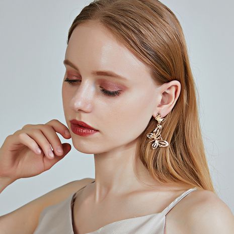 nouveau S925 boucles d'oreilles en argent pur en alliage boucles d'oreilles papillon creux en gros nihaojewelry's discount tags