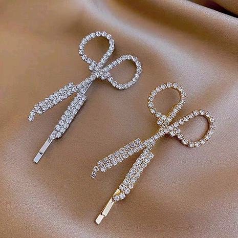 Korean fashion and sweet girl wearing diamond-studded scissors side hair clip NHSC248072's discount tags