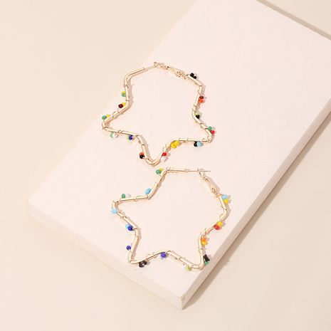 Boucle d'oreille étoile de niche de style ethnique avec perles de riz tissées à la main étoile à cinq branches exagérée pour les femmes's discount tags