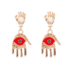 retro alloy inlaid pearl red eyes palm fashion earrings wholesale