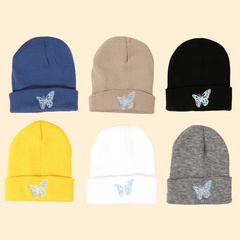 Hot selling fashion Pure color knitted embroidery butterfly warm woolen hat wholesale