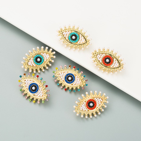 retro devil's eye alloy inlaid pearl rhinestone earrings's discount tags