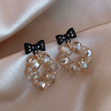 Black bow crystal earrings's discount tags