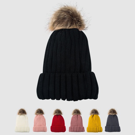 Venta al por mayor de fábrica sombrero femenino de invierno de estilo coreano más bolas esponjosas gorra de lana pareja de manga de estudiante gorro de punto grueso's discount tags