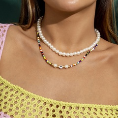 Mélanger et assortir des bijoux transfrontaliers collier de couleur contrastante tissé de perles de riz imitation collier de lettre d'oeil de perle