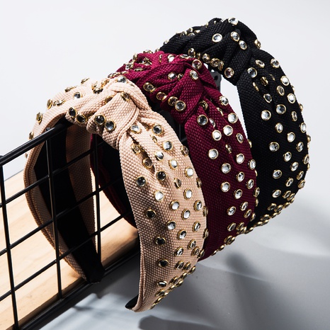 Korean version of solid color fabric knotted rhinestone headband's discount tags