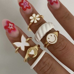 Nuevo anillo sonriente de mariposa de moda transfronteriza de Europa y América, conjunto de 6 piezas de flor de corazón de melocotón blanco