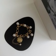 retro metal imitation pearl person head round brand bracelet necklace elegant braceletpicture20