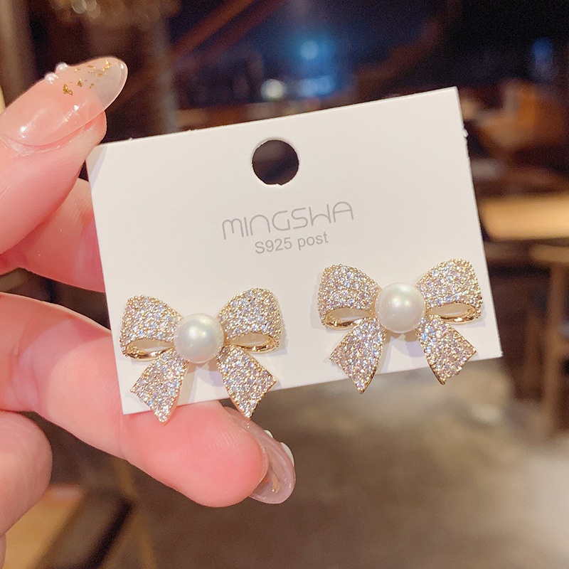 Pendientes de botn de lazo con micro incrustaciones coreanas pendientes de perlas exageradas femeninas al por mayor