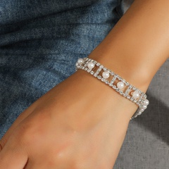 Fashion hollow shape inlaid pearl rhinestone alloy bracelet