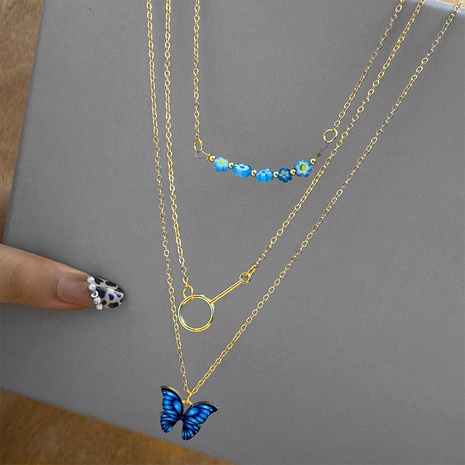 Neue kreative einfache Modeschmuck tropfende Strass Schmetterling Anhänger dreilagige Halskette's discount tags