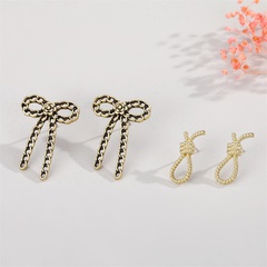 retro personality metal hollow chain bow stud earrings creative knotted long earrings