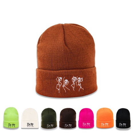 Orange hat Korean version of the trend of skull dancing knitted hat warm ear protection hat Japanese wild wool hat's discount tags