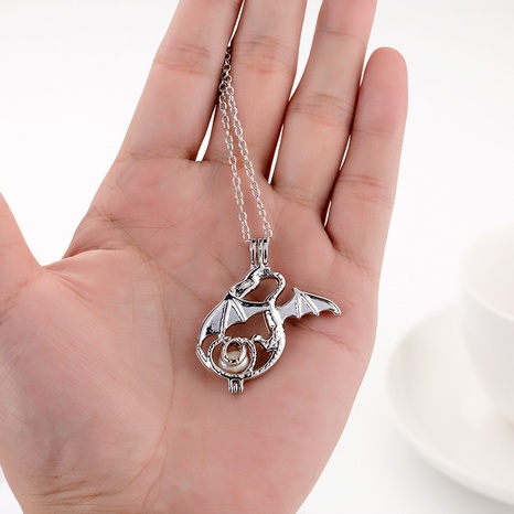 Wish Amazon European and American Popular Personalized Pearl Cage Quetzalcoatlus Graphic Pendant Jewelry Necklace's discount tags