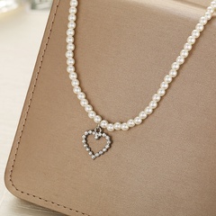 Retro Perlenkette Schlüsselbeinkette Kurze hohle Herzkette