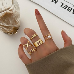 Europa y América Cruz frontera nueva creativa Simple moda mujer joyería hueco mariposa Cruz perla anillo conjunto de 5