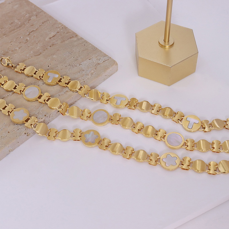 fashion titanium steel plated 18k gold tshaped small flower round white sea shell bracelet