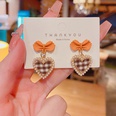 Korean autumn and winter black and white lattice bow earrings female wholesalepicture10