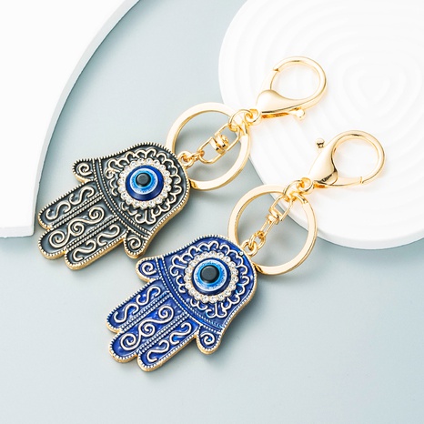 European and American alloy oil dripping diamond palm eye keychain's discount tags