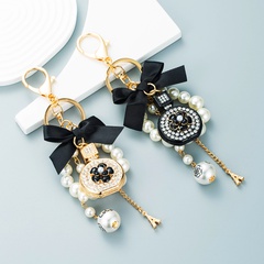 New creative small gift pendant perfume bottle bow shape alloy diamond keychain
