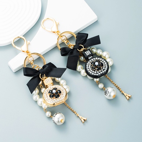 New creative small gift pendant perfume bottle bow shape alloy diamond keychain's discount tags