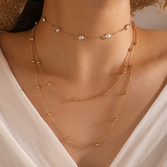 arbeiten Sie mehrschichtige Perlenschlüsselbeinkette weibliche einfache lange Legierungshalskette um