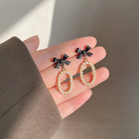 Plata de Ley aguja japonesa y coreana Ins estilo arco perla ovalada pendientes elegantes de moda dama H4130's discount tags