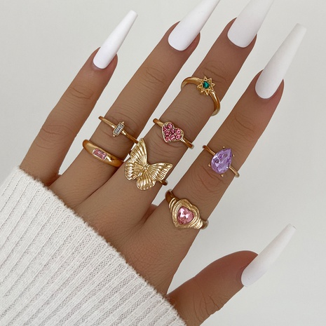 Comercio exterior diseño creativo personalidad moda mariposa Rosa amor corazón diamante seis puntas estrella nudillo anillo de siete piezas's discount tags
