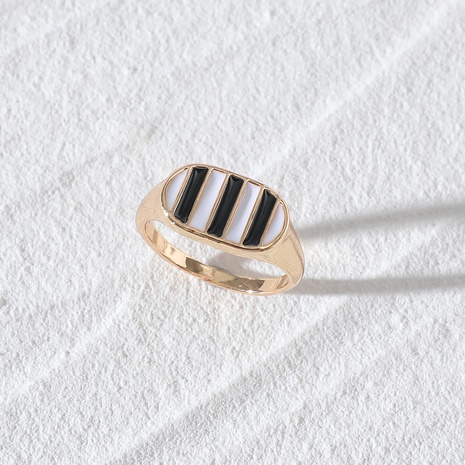 European and American fashion jewelry black and white stripes dripping oil checkerboard ring's discount tags