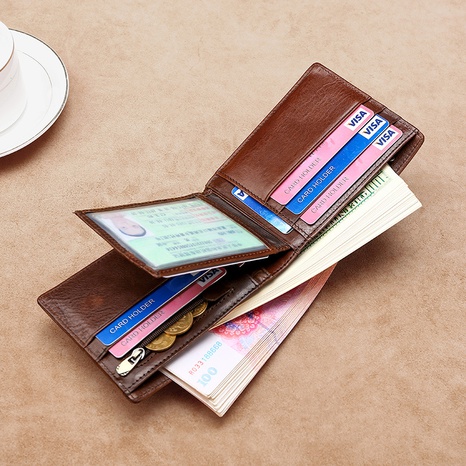 Portefeuille pour hommes en cuir de mode couche supérieure en cuir de vachette portefeuille décontracté court porte-monnaie multi-cartes en gros's discount tags