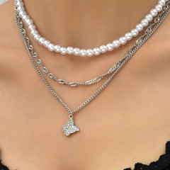 Europäische und amerikanische Modeimitat-Perle mit Zirkonia-Schmetterling-Anhänger mehrschichtige Halskette
