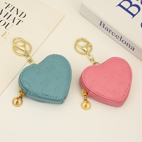 Monedero en forma de corazón pareja coreana mochila colgante pu bolsa de almacenamiento de auriculares al por mayor's discount tags