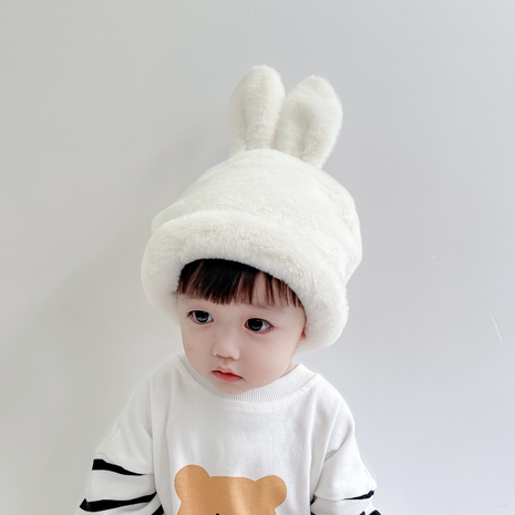 Korean version of children's plush hood winter new warm bunny ear caps's discount tags