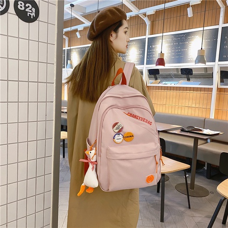 Korean version of simple backpack college style hit color cute schoolbag's discount tags