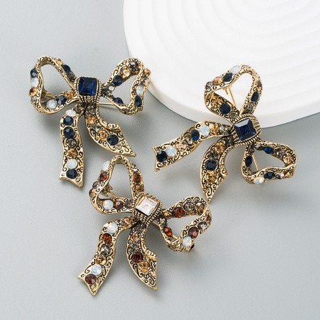 retro creative rhinestone brooch alloy plating bow women's corsage clothing accessories NHLN523973's discount tags