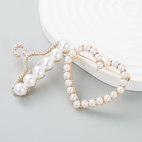 Korean style hollow heart pearl brooch female sweet brooch accessories NHLN523966's discount tags
