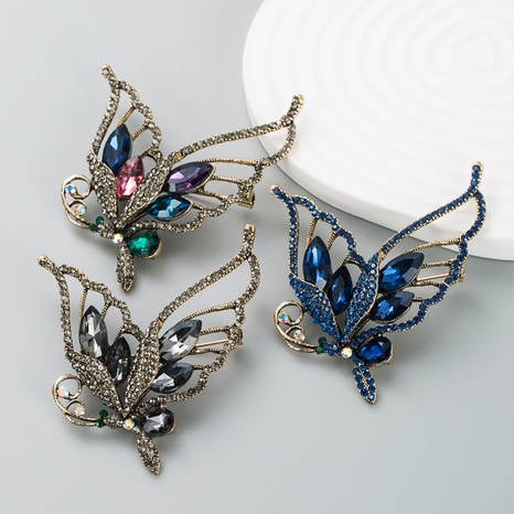 Korean fashion hollow butterfly brooch jewelry alloy inlaid rhinestone creative brooch  NHLN523960's discount tags