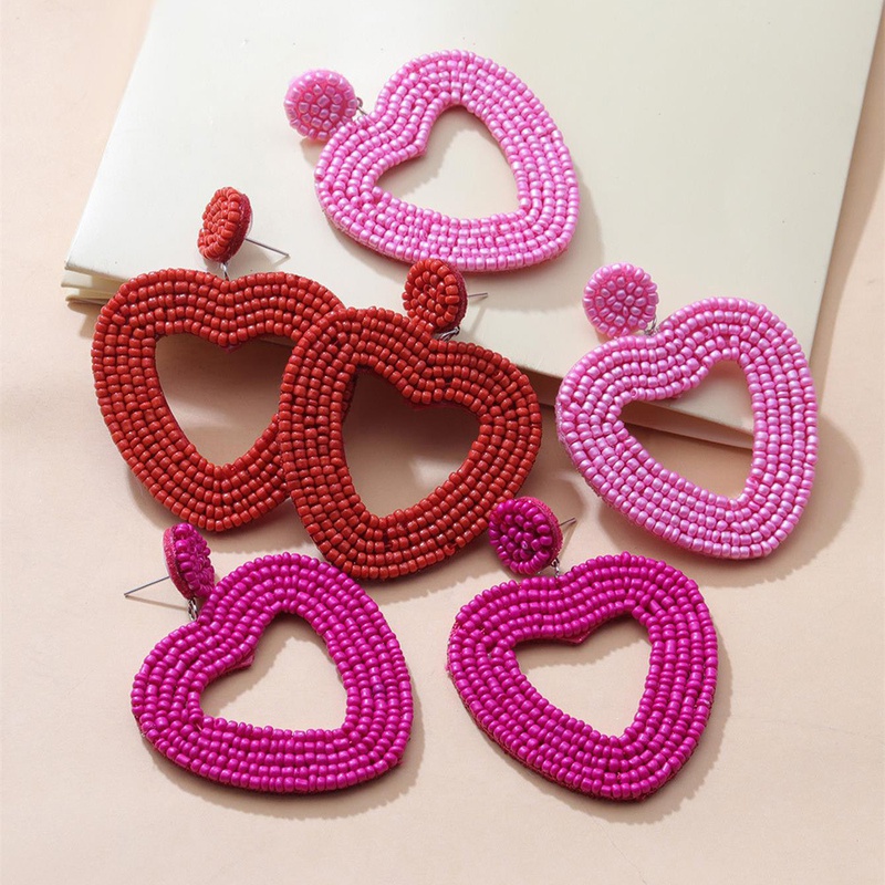 Boucles d39oreilles creuses en forme de coeur avec perles rouges ethniques de couleur de vacances