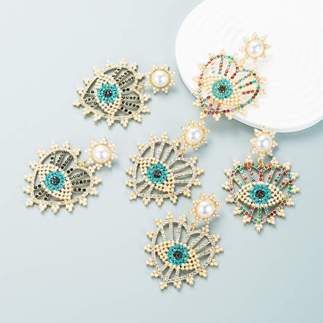 Pendientes de ojo en forma de corazón de perlas con incrustaciones de diamantes de color de moda's discount tags
