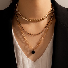mehrschichtige Halskette mit schwarzen Perlen, dreilagig mit geometrischer Kette