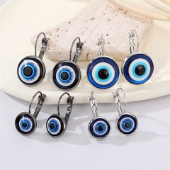 Boucles d'oreilles oeil de diable à paillettes rétro avec bordure en métal bronze et yeux bleus