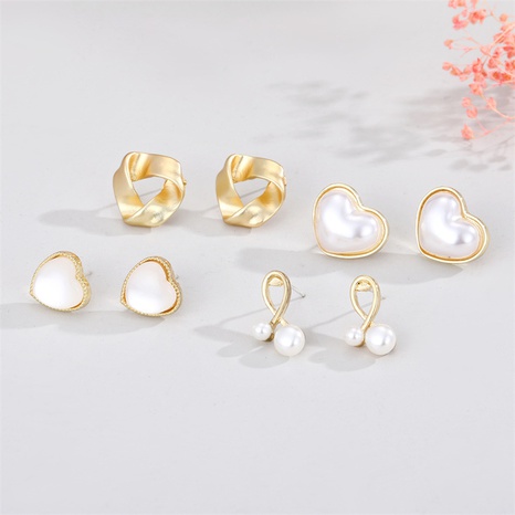 Pendientes de corazón de melocotón de ópalo de perla simple de tendencia coreana al por mayor femenino's discount tags