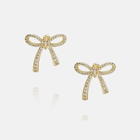 Boucles d'oreilles en cuivre à nœud tendance en trois dimensions avec zircon à la mode's discount tags