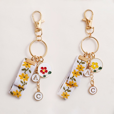 New cute alloy keychain pendant sunflower English alphabet metal keychain's discount tags