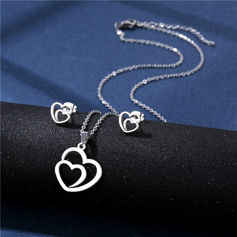 Simple hollow heart stainless steel necklace earring set jewelry wholesale NHAC564248's discount tags